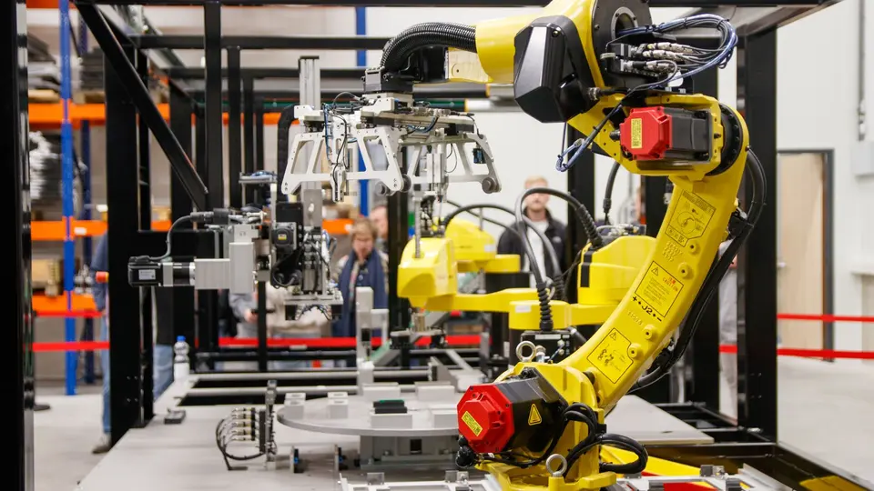Advanced robotic arm manipulating electronics on high-tech assembly line