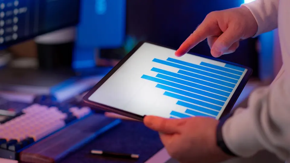 Marketing director interpreting neuro-metric response data on interactive tablet